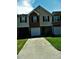 Charming townhome with a one-car garage and well-manicured front lawn at 615 Magnolia Gardens Walk, Mcdonough, GA 30253