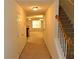 Inviting hallway with staircase leads to spacious living areas at 615 Magnolia Gardens Walk, Mcdonough, GA 30253