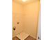 Functional laundry room with washer hookups and shelving for convenient storage solutions at 615 Magnolia Gardens Walk, Mcdonough, GA 30253