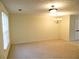 Open living space with ample natural light and chandelier at 615 Magnolia Gardens Walk, Mcdonough, GA 30253