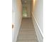 Carpeted staircase with white railing leading to upper level at 615 Magnolia Gardens Walk, Mcdonough, GA 30253