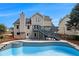 Exterior of home overlooking swimming pool and deck at 651 Deer Oaks Dr, Lawrenceville, GA 30044
