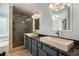 Bathroom features a double vanity, granite countertop, and glass enclosed shower at 651 Deer Oaks Dr, Lawrenceville, GA 30044