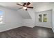 Bright bedroom features new flooring, fresh paint, modern ceiling fan and two windows at 651 Deer Oaks Dr, Lawrenceville, GA 30044