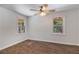 Bright bedroom features new flooring and two windows at 651 Deer Oaks Dr, Lawrenceville, GA 30044