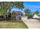 Traditional two-story home featuring a brick facade, attached garage, and a well-maintained front lawn at 651 Deer Oaks Dr, Lawrenceville, GA 30044