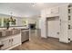 Spacious open-concept kitchen flows into the living area, featuring stainless appliances and granite countertops at 651 Deer Oaks Dr, Lawrenceville, GA 30044