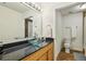 Stylish bathroom featuring a glass bowl sink, granite countertop, and modern fixtures at 800 Peachtree Ne St # 2304, Atlanta, GA 30308