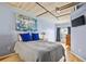 Comfortable bedroom featuring hardwood floors and large windows at 800 Peachtree Ne St # 2304, Atlanta, GA 30308