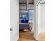 Cozy bedroom with exposed concrete ceiling, closet, and decorative accents at 800 Peachtree Ne St # 2304, Atlanta, GA 30308