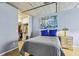 Cozy bedroom with exposed concrete ceiling, closet, and decorative accents at 800 Peachtree Ne St # 2304, Atlanta, GA 30308