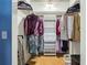Walk-in closet with organized shelving and ample storage space for clothes and accessories at 800 Peachtree Ne St # 2304, Atlanta, GA 30308