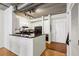 Kitchen with white cabinetry, granite countertops, and modern appliances that overlooks the living area at 800 Peachtree Ne St # 2304, Atlanta, GA 30308