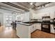 Well lit kitchen with white cabinetry, granite countertops, stainless steel appliances, and an open design at 800 Peachtree Ne St # 2304, Atlanta, GA 30308