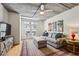 Comfortable living room with french doors to a balcony, hardwood floors, and modern decor at 800 Peachtree Ne St # 2304, Atlanta, GA 30308