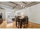 Open floor plan with modern lighting and hardwood floors extending to a dining area and living room at 800 Peachtree Ne St # 2304, Atlanta, GA 30308