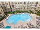 Overhead view of a sparkling swimming pool with plenty of lounge chairs at 800 Peachtree Ne St # 2304, Atlanta, GA 30308