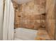 Shower with tile surround, built-in niche and bench, and a handheld shower head at 800 Peachtree Ne St # 2304, Atlanta, GA 30308