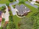 An aerial view showcases manicured landscaping, a back deck, and the home's lush surroundings at 1364 Gulfport Run, Grayson, GA 30017