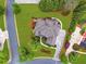 Birds eye view displays a landscaped yard, tree coverage, and neighborhood location at 1364 Gulfport Run, Grayson, GA 30017