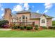Spacious backyard featuring a wooden deck, lush lawn, and detailed brickwork on the house at 1364 Gulfport Run, Grayson, GA 30017