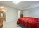 Basement bedroom featuring carpet, neutral walls, a flourescent light, and a door to another part of the house at 1364 Gulfport Run, Grayson, GA 30017