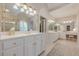 Spacious primary bathroom with dual vanities, large mirrors, and a separate shower area at 1364 Gulfport Run, Grayson, GA 30017