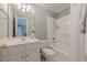 Bathroom with white tiled shower and white vanity with ample storage space at 1364 Gulfport Run, Grayson, GA 30017