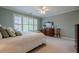 This bedroom features neutral walls, carpet and a large window providing ample light at 1364 Gulfport Run, Grayson, GA 30017