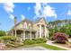 Community clubhouse featuring large columns, covered patio, and landscaped entryway at 1364 Gulfport Run, Grayson, GA 30017