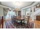 Formal dining room with large windows, chandelier, and ample seating for gatherings at 1364 Gulfport Run, Grayson, GA 30017