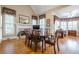 Cozy dining area with a fireplace, decorative window treatments, and stylish furniture at 1364 Gulfport Run, Grayson, GA 30017