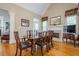 Charming dining space features hardwood floors, and a cozy fireplace at 1364 Gulfport Run, Grayson, GA 30017