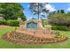 Stone community sign, 'North Forke', adorned with landscaping and colorful flowers at 1364 Gulfport Run, Grayson, GA 30017
