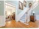 Grand foyer showcasing hardwood floors, staircase, and access to formal living spaces at 1364 Gulfport Run, Grayson, GA 30017