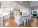 Modern kitchen with white cabinetry, stainless steel appliances, and a spacious center island at 1364 Gulfport Run, Grayson, GA 30017