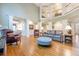 Spacious living area with hardwood flooring, elegant furnishings, and a view of the upper level at 1364 Gulfport Run, Grayson, GA 30017