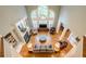 Open-concept living room with hardwood floors, fireplace, and large windows at 1364 Gulfport Run, Grayson, GA 30017