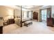 Serene primary bedroom with a four-poster bed, neutral tones, and plenty of natural light at 1364 Gulfport Run, Grayson, GA 30017