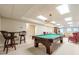 Versatile recreation area with pool table, bar seating, and adjacent lounge space at 1364 Gulfport Run, Grayson, GA 30017
