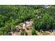 Aerial view showing property with wooded acreage and horse arena at 1369 N Highway 16, Whitesburg, GA 30185