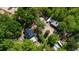 Aerial shot of a lush wooded estate, featuring a single Gathering home and additional structures in a private setting at 1369 N Highway 16, Whitesburg, GA 30185