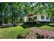 The backyard features a partially above ground swimming pool, and wooden patio at 1369 N Highway 16, Whitesburg, GA 30185