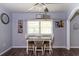 Eat-in dining area with natural light and table with chairs at 1369 N Highway 16, Whitesburg, GA 30185