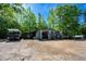 Large metal shop featuring an RV, boat and trailer parked in front with plenty of outdoor storage space at 1369 N Highway 16, Whitesburg, GA 30185