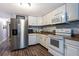 Modern kitchen with stainless steel appliances and granite countertops at 1369 N Highway 16, Whitesburg, GA 30185