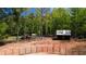 Horse property featuring an arena, storage shed, and several gates at 1369 N Highway 16, Whitesburg, GA 30185