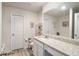 Bathroom with granite vanity, a large mirror, and a toilet with matching hardware at 231 Limestone Cir, Conyers, GA 30013