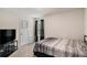 Minimalist bedroom with dark curtain panels, a comfortable bed, and a TV at 231 Limestone Cir, Conyers, GA 30013