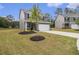 Beautifully landscaped front yard of a well-kept home, complete with a two-car garage at 231 Limestone Cir, Conyers, GA 30013